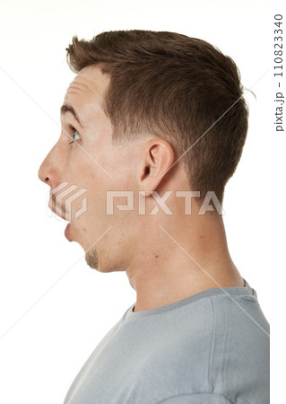 surprised guy looking at camera on white studio background 110823340