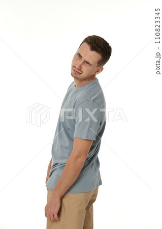 offended frustrated young man on white background. sadness 110823345