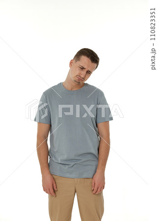 offended frustrated young man on white background. sadness offended frustrated young man on white background. sadness 110823351