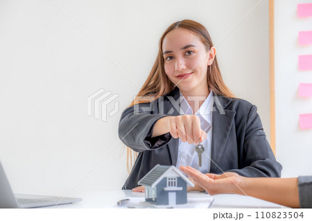 Caucasian real estate agents sale broker and buyers sign a business contract at home office and discuss saving money for renting, buying mortgage loan, or financial house insurance 110823504