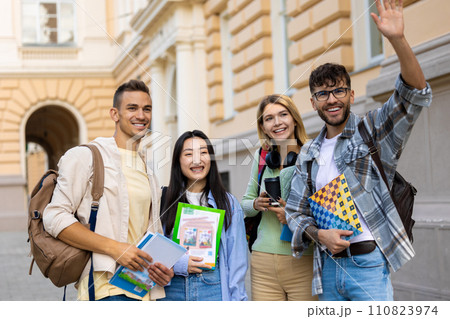 Multicultural group of college students or friends standing in campus. 110823974