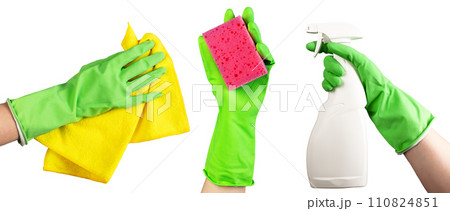 Hand in green glove holding washing sponge, cloth wiper for dust and spray bottle isolated on white Hand in green glove holding washing sponge, cloth wiper for dust and spray bottle isolated on white 110824851