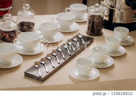 Group of empty white ceramic cups for coffee or tea in outside buffet at the business meeting event  110826812