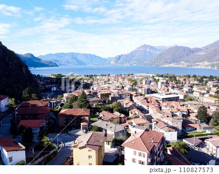 The Italian valley of Lake Como among the picturesque foggy peaks of the Alps.  110827573