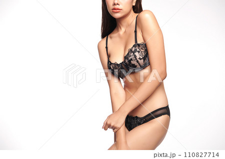 Confident beautiful young asian woman posing in black lingerie on white background, Perfect body, 110827714