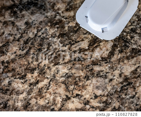 Ant trap poison bate on a granite kitchen countertop Ant trap poison bate on a granite kitchen countertop 110827828