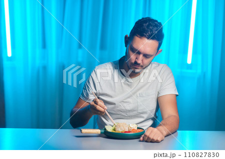 Unrecognizable man eating poke bowl with salmon,avocado,seaweed Unrecognizable man eating poke bowl with salmon,avocado,seaweed 110827830