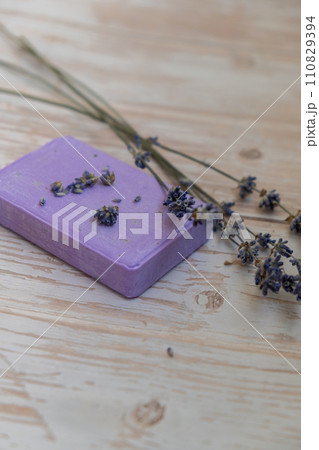 Handcrafted purple lavender soap with lavender flowers. Natural hydrating moisturiser softness cosmetic. Organic calming beauty skincare product. Herbal self care wellness alternative soap 110829394