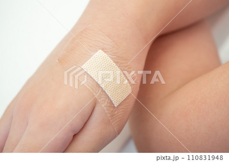 waterproof adhesive plaster on little kid hand 110831948