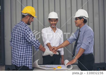 Group of multiracial people Teamwork meeting join hands Engineer Manager Foreman fist bump together. Close up diversity engineer people hands partner teams. Business connection team join partnership 110832236