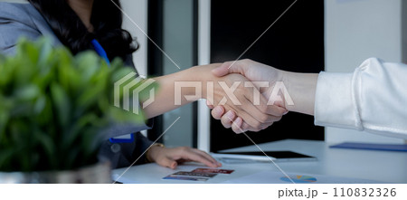 Hand shake after Employees present with mock up credit card payments to business customers. Ready to provide discounts and life insurance Hand shake after Employees present with mock up credit card payments to business customers. Ready to provide discounts and life insurance 110832326