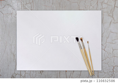 Artist Paint Brush on Blank White Paper. Top View. Drawing Tools in Art Studio. 110832586