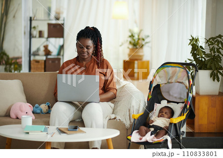 Mother of newborn baby working from home when her daughter is sleeping 110833801