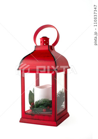 Red Christmas lantern with white candle with pine branches on a white background Red Christmas lantern with white candle with pine branches on a white background 110837347
