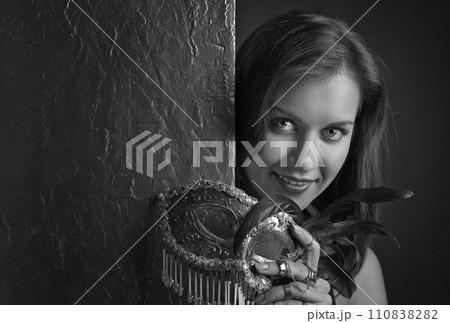 young beautiful woman with carnival mask. 110838282