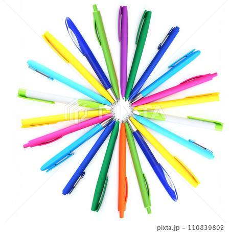 Multi colored ball pens on white background 110839802