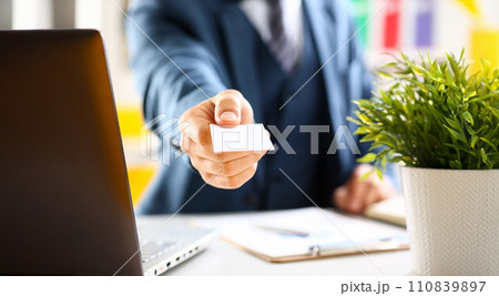 Male arm in suit give blank calling card 110839897