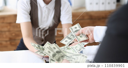 Businessman and business woman counting Businessman and business woman counting 110839901