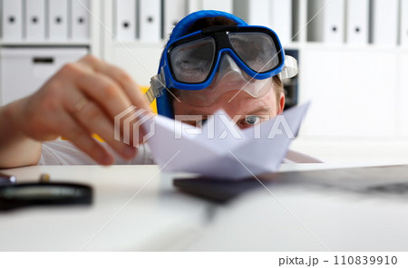 Man wearing suit and tie in goggles and snorkel Man wearing suit and tie in goggles and snorkel 110839910