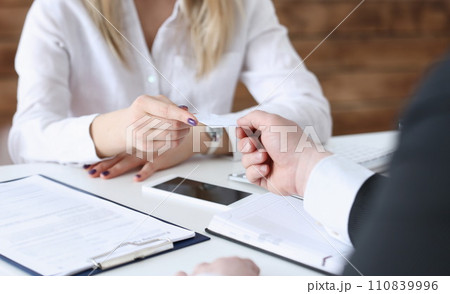 Female hand in suit give blank calling card male 110839996