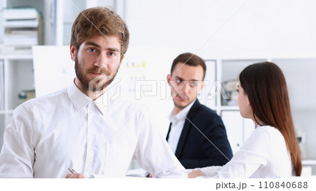 Handsome smiling bearded man in office Handsome smiling bearded man in office 110840688