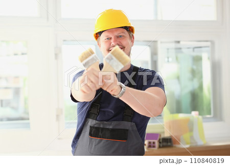 Arm of smiling worker hold brush closeup 110840819