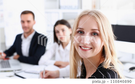Beautiful smiling cheerful girl at workplace Beautiful smiling cheerful girl at workplace 110840890
