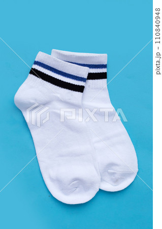 White socks on blue background. 110840948