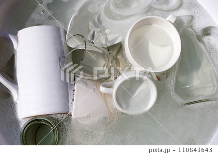 Washing used drinking glasses and cups 110841643
