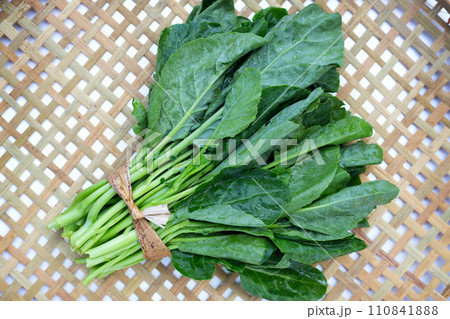 Collard greens on bamboo weave plate Collard greens on bamboo weave plate 110841888