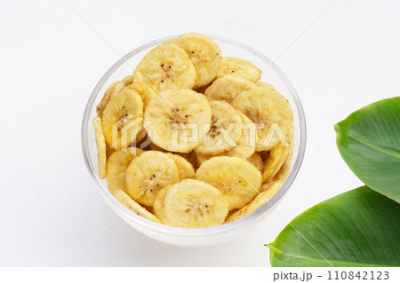 Banana slice chips on white background. Banana slice chips on white background. 110842123