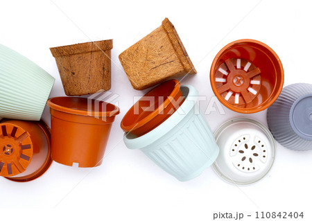 Plastic plant pots, containers on white background. Plastic plant pots, containers on white background. 110842404