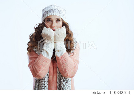 stylish woman and warming hands with breath 110842611