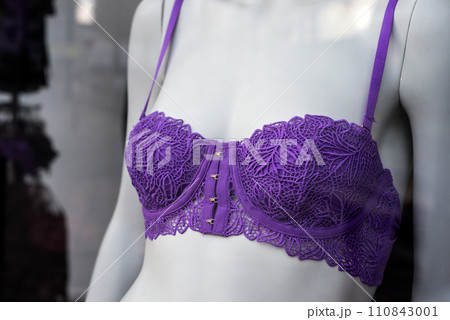 Closeup of purple bra on mannequin in a fashion store showroom 110843001