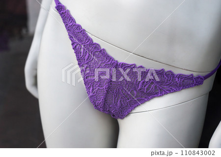 Closeup of purple cheeky on mannequin in a fashion store showroom Closeup of purple cheeky on mannequin in a fashion store showroom 110843002