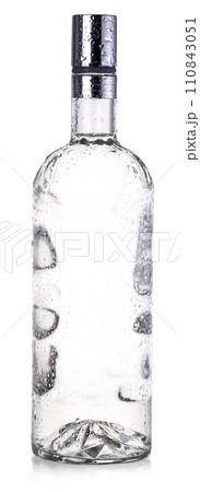 Glass bottle of vodka with drops isolated on white background with clipping path Glass bottle of vodka with drops isolated on white background with clipping path 110843051