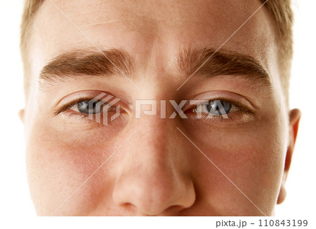 Optical health clinic. Contact lens with focus on natural look of product. Close-up of a young male's eyes 110843199