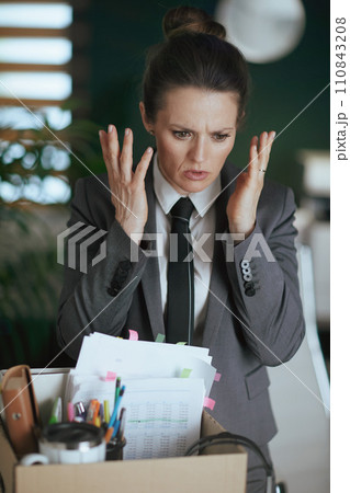 stressed modern woman worker in modern green office 110843208