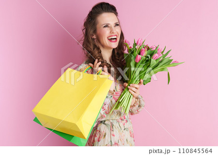 happy stylish woman with long wavy brunette hair on pink happy stylish woman with long wavy brunette hair on pink 110845564