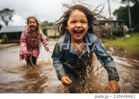 Joyful Children Playing in Rain Puddles. Generative AI 110846661