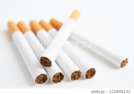 Cigarette on US dollar banknotes, cost, trading, marketing and production, No smoking, imort export concept. Cigarette on US dollar banknotes, cost, trading, marketing and production, No smoking, imort export concept. 110848132