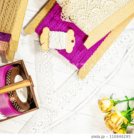 Colored ribbons and lace in coils for hobbies Colored ribbons and lace in coils for hobbies 110848295