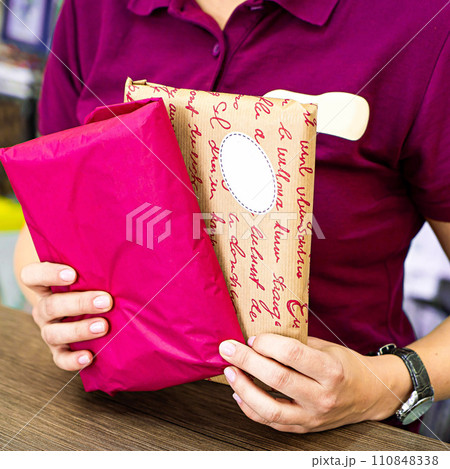 Delivery mail post postal packages red and craft paper in hands Delivery mail post postal packages red and craft paper in hands 110848338