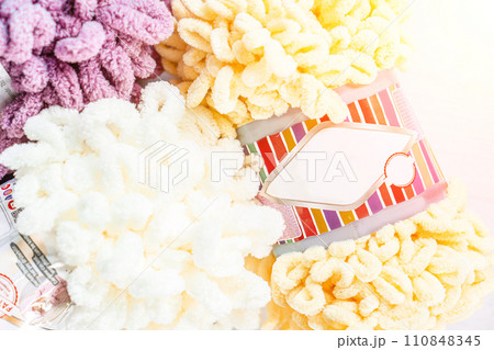 Fluffy yarn. Colored threads in reels. Knitting hobby embroidery 110848345