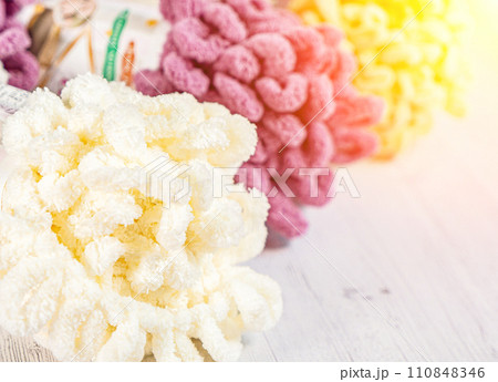 Fluffy yarn. Colored threads in reels. Knitting hobby embroidery Fluffy yarn. Colored threads in reels. Knitting hobby embroidery 110848346