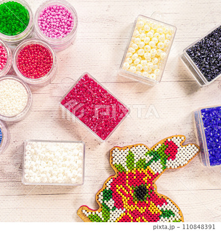 Colorful glass beads. Variety of shapes and colors to make a bead necklace or a string of beads for women 110848391