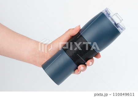 Metal blue mug in hand 110849611