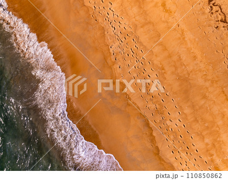 Amazing Top view dark sea beach landscape background,Summer sea waves crashing on sandy shore seascape background,High angle view ocean nature background Amazing Top view dark sea beach landscape background,Summer sea waves crashing on sandy shore seascape background,High angle view ocean nature background 110850862