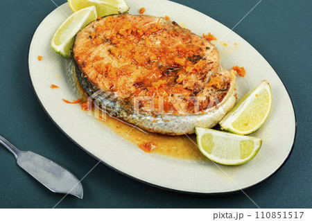 Grilled salmon steak in orange marinade. Grilled salmon steak in orange marinade. 110851517