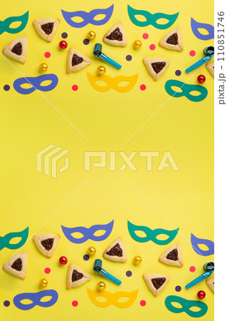 Hamantaschen Cookies for Purim Celebration on Yellow Background 110851746